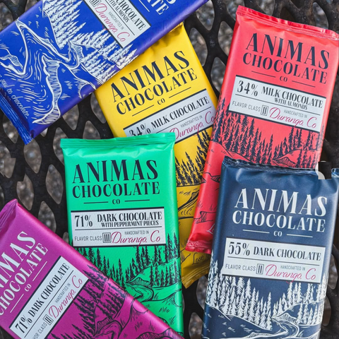 Assorted Animas Chocolate bars in various flavors and packaging colors.