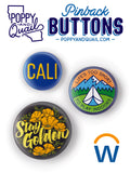 Three colorful buttons with text and graphics on a white background, featuring the brand 'Poppy and Quail'.